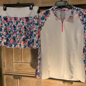 Colorful matching shirt & skirt with white shorts underneath. Smoke & pet free.